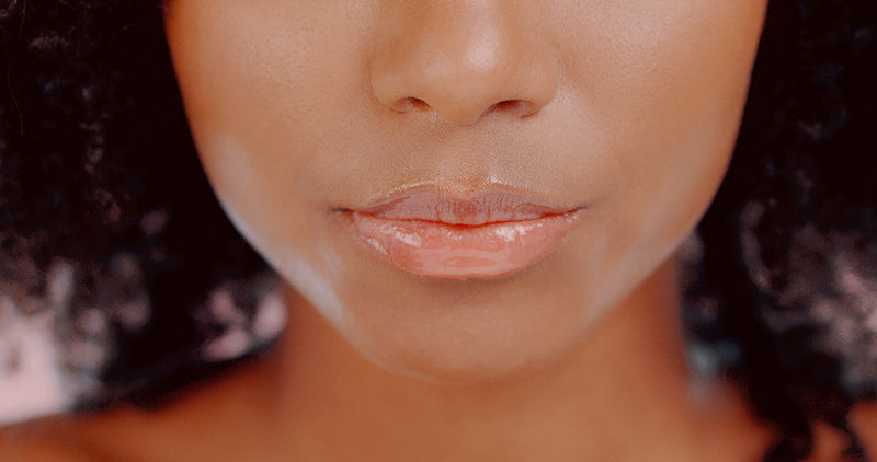 Woman wearing L'Oreal Infallible Pro Gloss Plump in shade 601 Rosy Flush showing glossy plumped lips