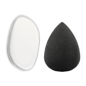 Set of black teardrop beauty sponges on white background