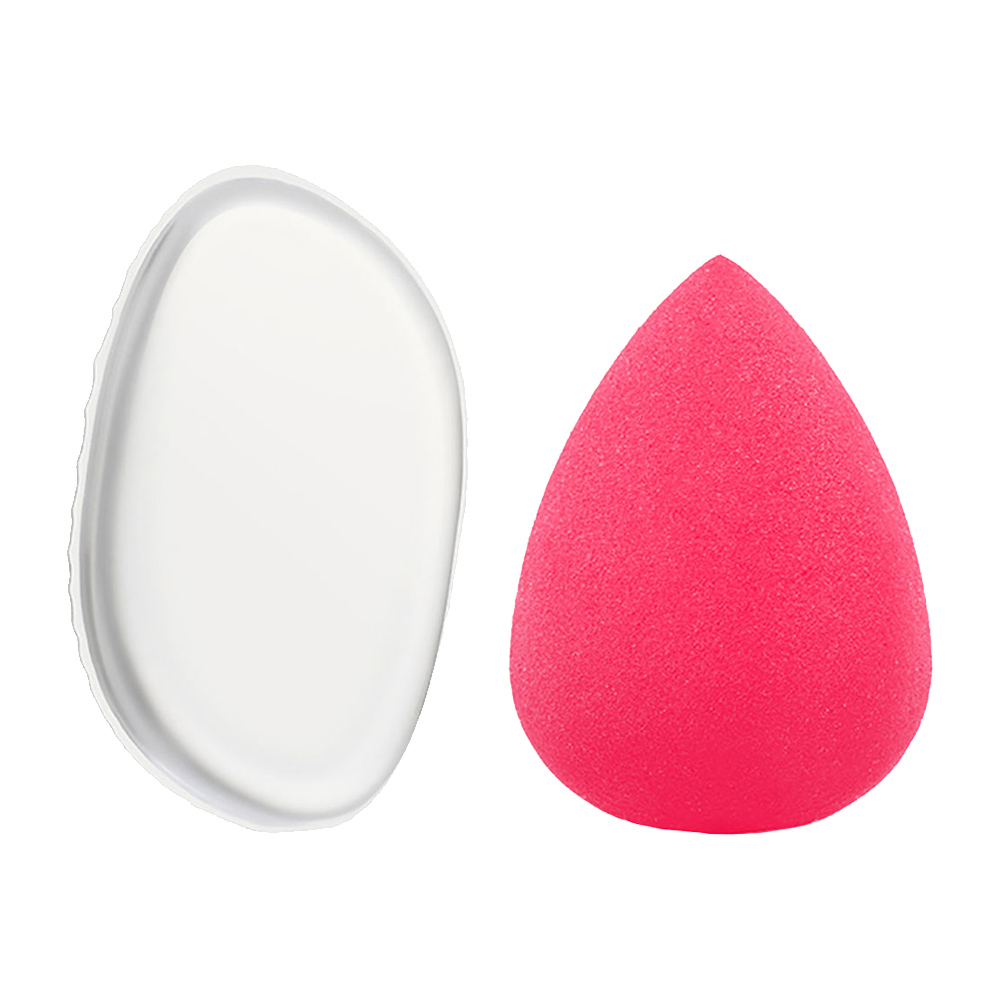 Set of pink teardrop beauty sponges on a white background